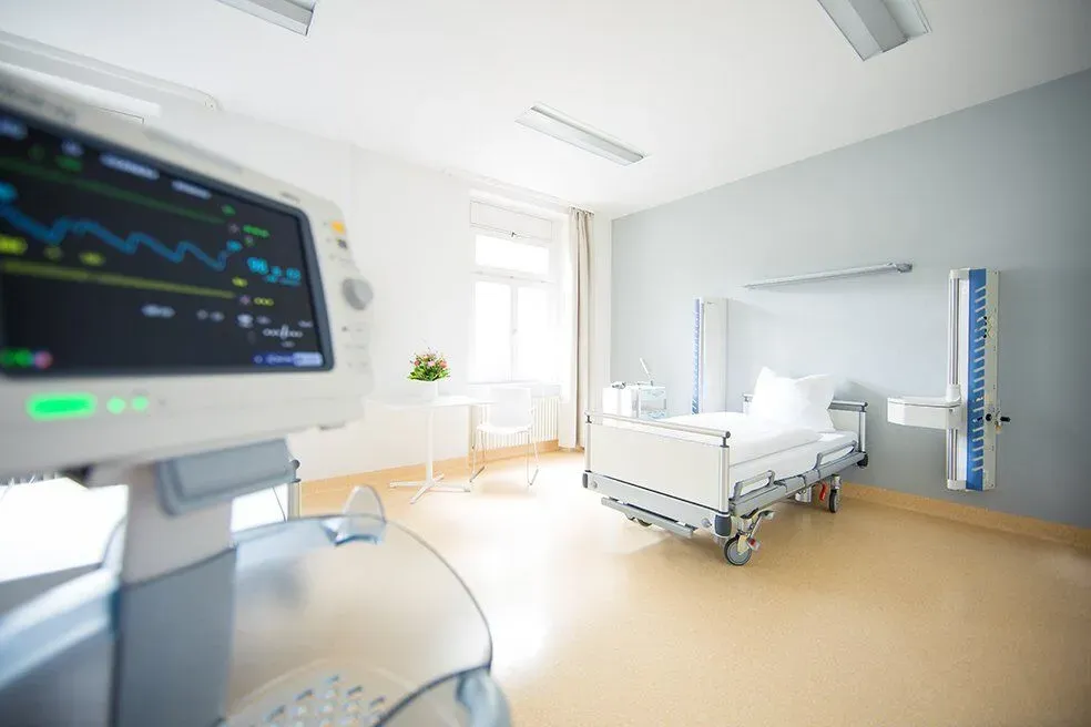 Patient room with bed and monitoring screen