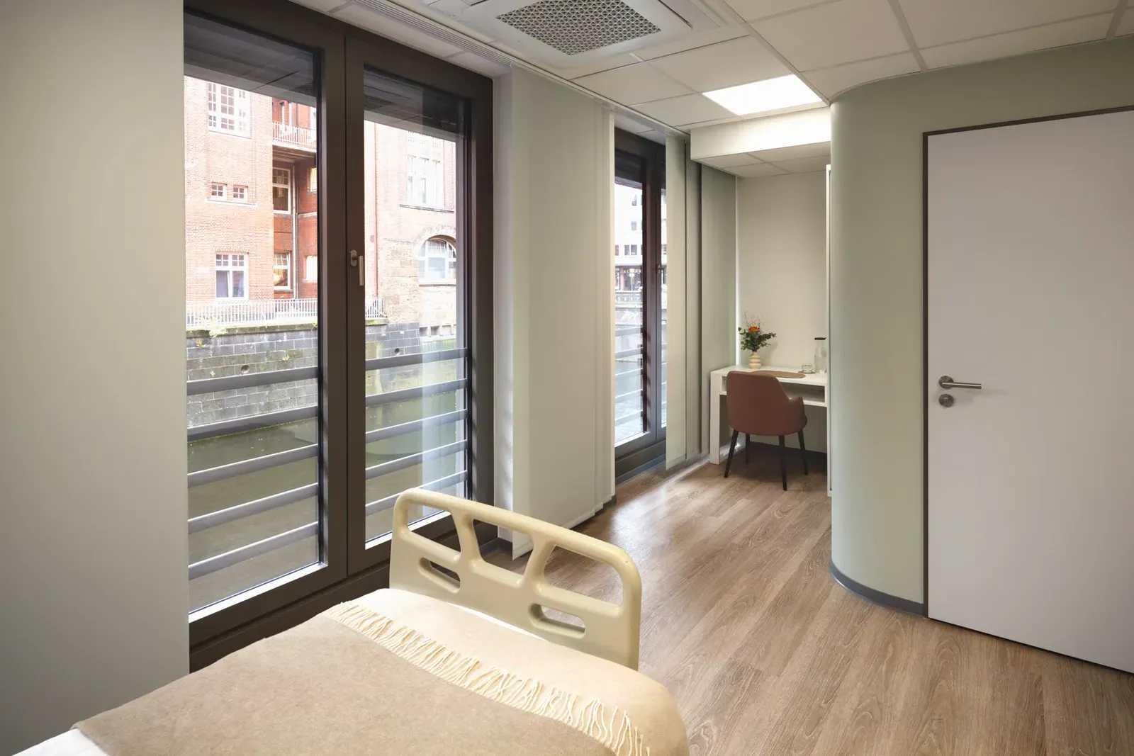 Patient suite with large windows overlooking the canal