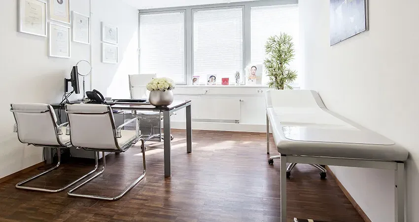Consulting room with a desk and examination couch