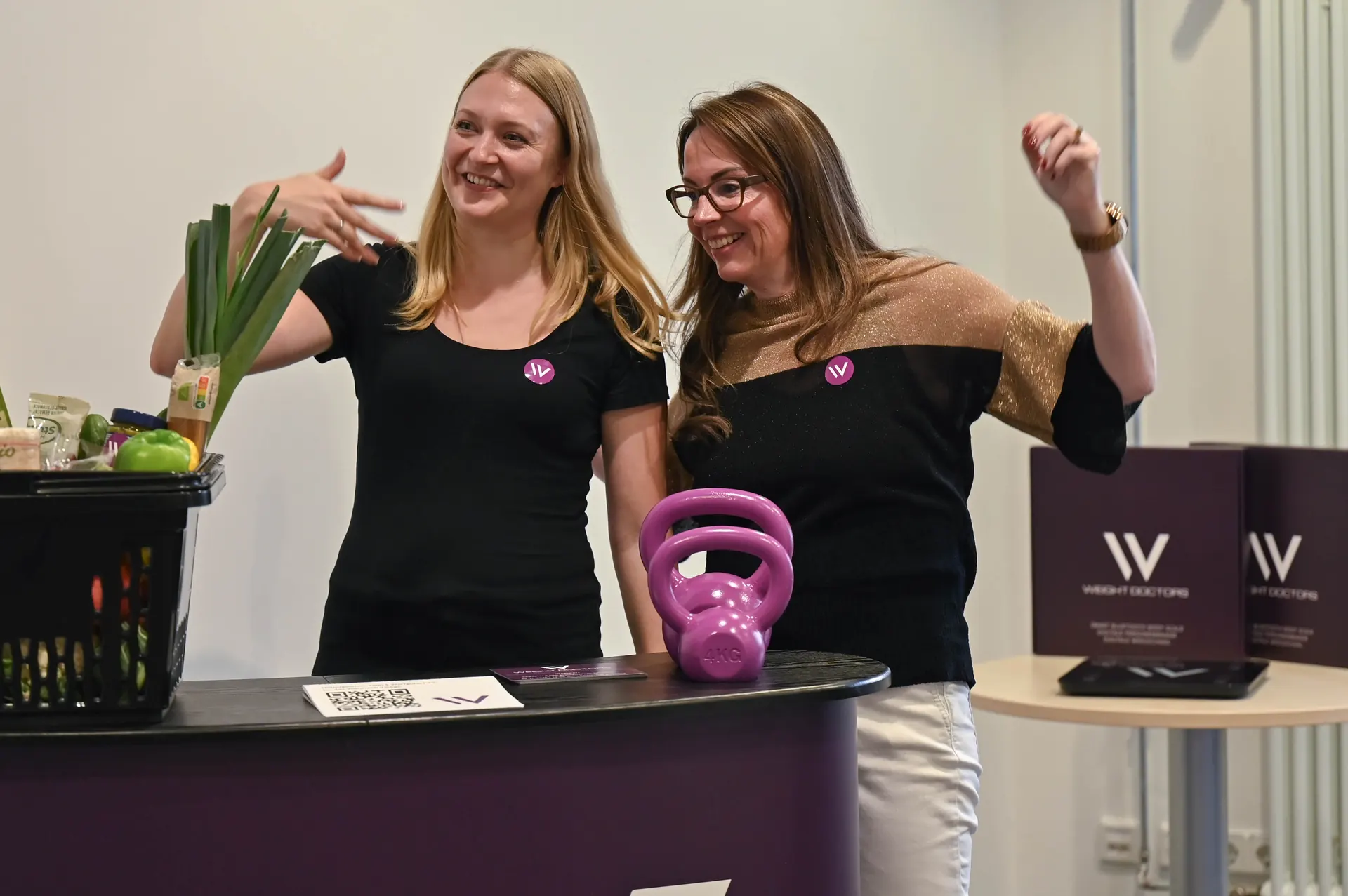 Two Weight Doctors® colleagues at a stall with fresh vegetables